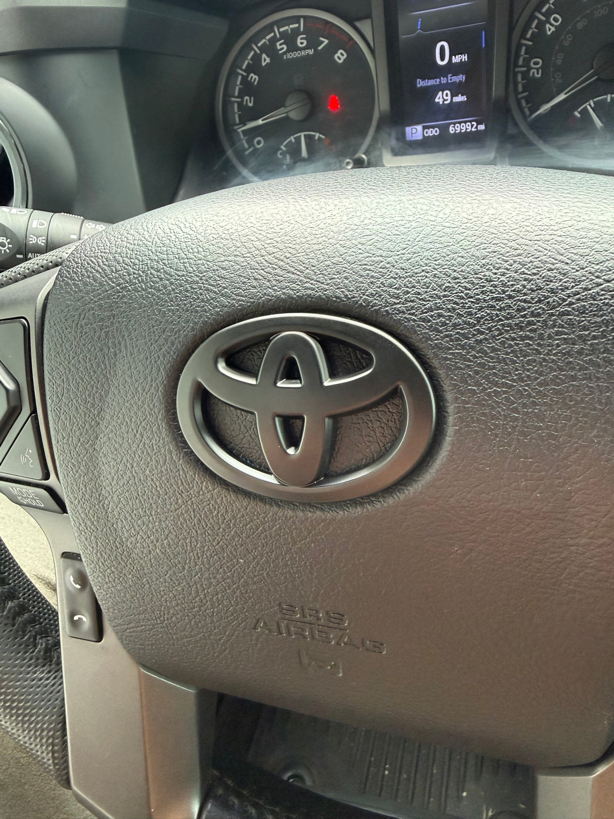Matte Black Steering Wheel Emblem Cover — Fits 3rd Gen Tacoma (2016–2023)